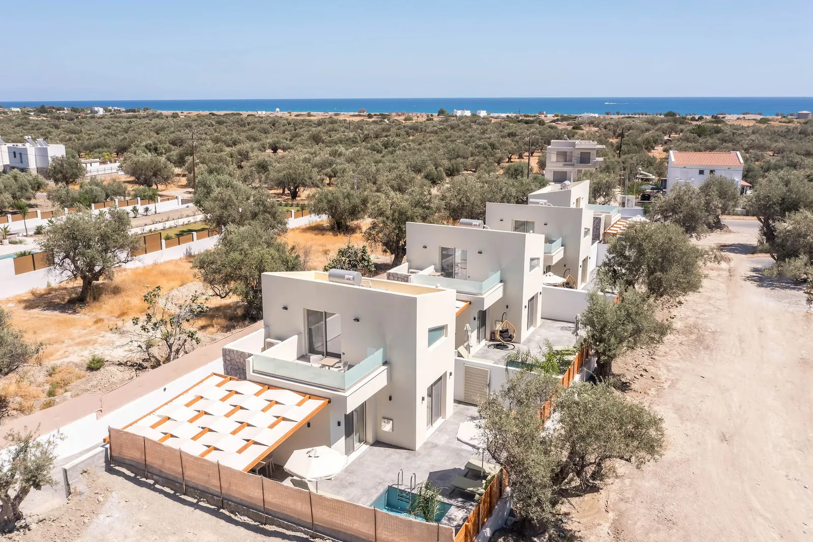 Aerial side view of the four villas