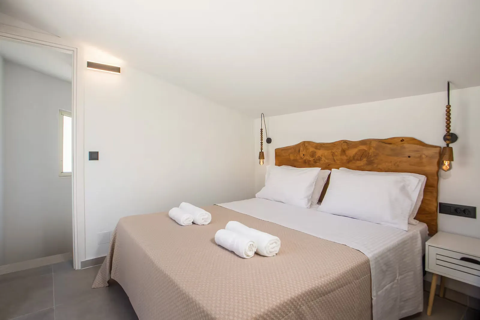 Bedroom with live-edge headboard